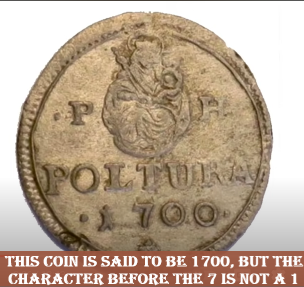 coin with strange character preceding date
